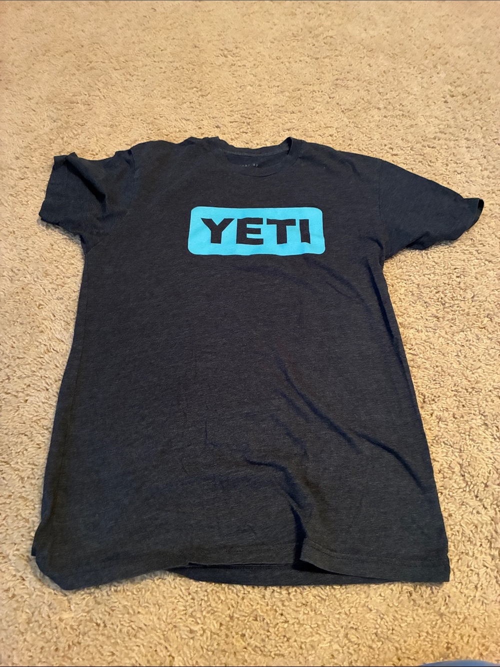 Yeti Navy T‑Shirt with Aqua Logo (size small).